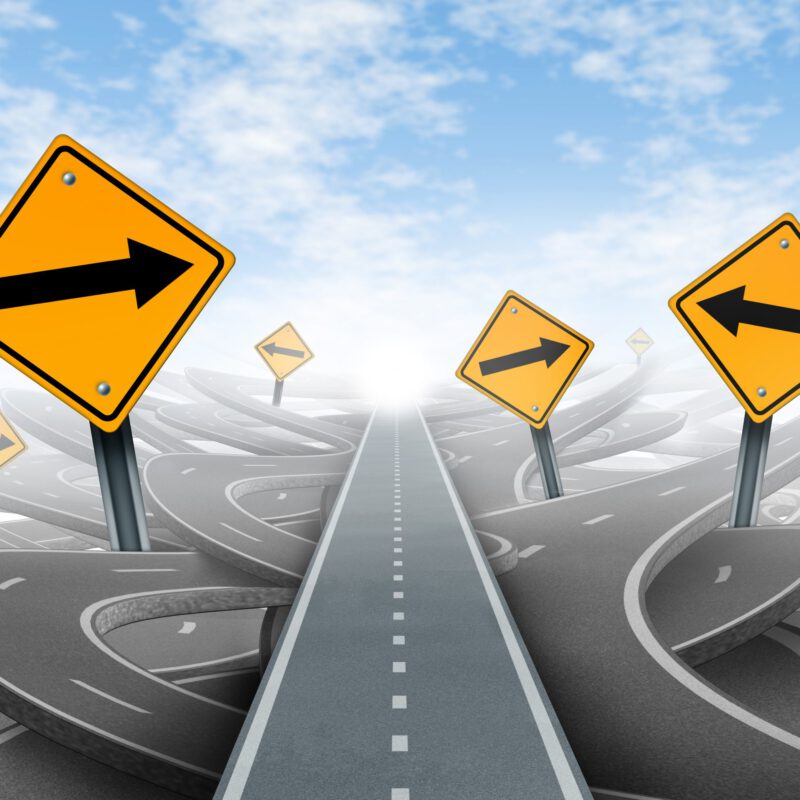 Clear strategy and solutions for business leadership symbol with a straight path to success as a journey choosing the right strategic path for business with blank yellow traffic signs cutting through a maze of tangled roads and highways.